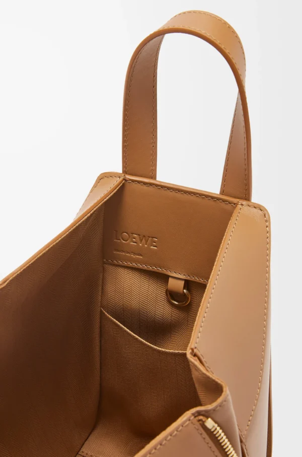 34afb5039ff335b56a1b6ddda9e25be1-scaled-1.webp Compact Hammock bag in satin calfskin