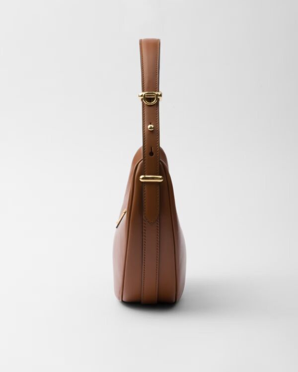 669dfe91d64b9f3e3bfad23c6a3b0828.jpg Prada Arqué small leather shoulder bag