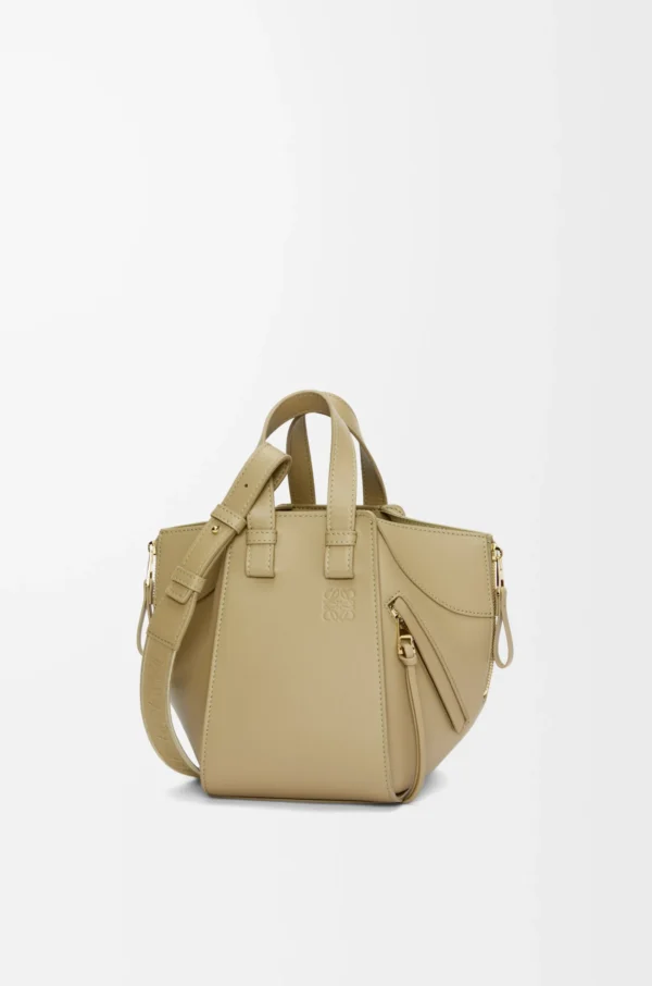 a85ebc851ccf172aadc5e33cb44abc4e-scaled-1.webp Compact Hammock bag in satin calfskin